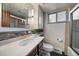 Updated bathroom with a modern vanity, stylish fixtures, and a tiled shower at 3540 Vrain St, Denver, CO 80212