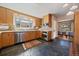 Bright kitchen offering stainless appliances, ample cabinets, and views to dining area at 3540 Vrain St, Denver, CO 80212
