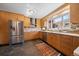 Stylish kitchen with stainless appliances, custom cabinets, and bright countertops at 3540 Vrain St, Denver, CO 80212