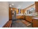 Modern kitchen features stainless steel appliances, sleek cabinets, and black tile flooring at 3540 Vrain St, Denver, CO 80212