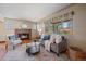 Inviting living room with stone fireplace, natural light, and comfortable seating at 3540 Vrain St, Denver, CO 80212