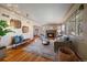 Cozy living room with a fireplace, hardwood floors, and neutral decor at 3540 Vrain St, Denver, CO 80212