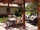 Inviting outdoor patio with a dining set, comfortable seating, and a charming pergola for shaded relaxation at 3540 Vrain St, Denver, CO 80212