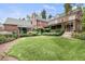 Expansive backyard with brick patio and lush landscaping at 869 Vine St, Denver, CO 80206