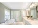 Elegant bathroom with soaking tub, walk-in shower, and marble vanity at 869 Vine St, Denver, CO 80206