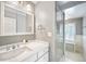 Clean bathroom with marble vanity and shower at 869 Vine St, Denver, CO 80206