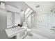 Elegant bathroom with marble shower and soaking tub at 869 Vine St, Denver, CO 80206