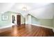 Large bedroom with hardwood floors and sloped ceilings at 869 Vine St, Denver, CO 80206