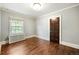 Simple bedroom with hardwood floors and lots of natural light at 869 Vine St, Denver, CO 80206