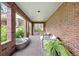 Brick front porch with seating and fire pit at 869 Vine St, Denver, CO 80206
