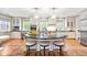 Spacious kitchen boasts white cabinets, granite counters, and an island at 869 Vine St, Denver, CO 80206
