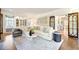 Bright living room with built-in shelving and hardwood floors at 869 Vine St, Denver, CO 80206