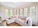 Bright sitting room with large windows and comfortable sectional sofa at 869 Vine St, Denver, CO 80206