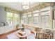 Sunroom with built-in seating and abundant natural light at 869 Vine St, Denver, CO 80206