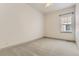 Bright bedroom with a window that lets in natural light, and carpeted flooring at 1562 Suncrest Rd, Castle Rock, CO 80104