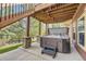 Outdoor hot tub on a private patio with stone accents and stairs, perfect for relaxation at 1562 Suncrest Rd, Castle Rock, CO 80104