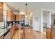 Beautiful kitchen featuring stainless steel appliances, a center island cooktop, and hardwood floors at 1562 Suncrest Rd, Castle Rock, CO 80104