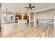 Open-concept floor plan with hardwood floors connecting the living room and kitchen at 1562 Suncrest Rd, Castle Rock, CO 80104