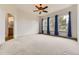 Spacious main bedroom with large windows and an en-suite bathroom, providing ample natural light at 1562 Suncrest Rd, Castle Rock, CO 80104