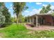 The backyard has lush landscaping and a sunroom, providing a relaxing outdoor living space at 6371 Brooks Dr, Arvada, CO 80004
