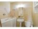 Comfortable bathroom featuring a walk-in tub with tiled walls and modern fixtures at 6371 Brooks Dr, Arvada, CO 80004
