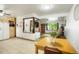Open kitchen view connecting to the living area, featuring essential appliances and a breakfast table, perfect for Gathering meals at 6371 Brooks Dr, Arvada, CO 80004