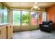 Light-filled sunroom with vinyl flooring and updated cabinets, perfect for relaxing with a view at 6371 Brooks Dr, Arvada, CO 80004