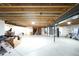 Spacious unfinished basement awaits personal touch, offering opportunity for storage or recreational area at 15987 E 115Th Pl, Commerce City, CO 80022