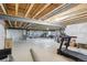 Unfinished basement offers ample space and potential, with visible beams and room for customization at 15987 E 115Th Pl, Commerce City, CO 80022