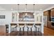 Beautiful kitchen featuring an island with seating and stainless steel appliances at 15987 E 115Th Pl, Commerce City, CO 80022