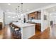 Bright kitchen with a large island, stainless steel appliances, and hardwood floors at 15987 E 115Th Pl, Commerce City, CO 80022