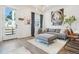 Bright living room with modern furnishings and an interesting art collection on display at 3550 W 63Rd Ave, Denver, CO 80221