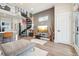 Open-concept living space with modern furniture, spiral staircase, and stylish accents at 3550 W 63Rd Ave, Denver, CO 80221