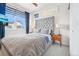 Cozy main bedroom featuring a plush bed, modern decor, and natural light at 3550 W 63Rd Ave, Denver, CO 80221
