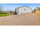 View of the backyard with a deck and a large gravel area at 2484 E 101St Ct, Thornton, CO 80229