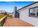 A view of the wooden deck that has a black chimney in the background at 2484 E 101St Ct, Thornton, CO 80229