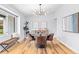 Beautiful dining room with modern light fixture, round table, and stylish decor at 2484 E 101St Ct, Thornton, CO 80229