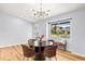 Dining room featuring modern lighting, comfortable seating, and a bright window view at 2484 E 101St Ct, Thornton, CO 80229