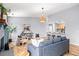 Open living space featuring a fireplace, comfortable seating, and seamless flow to the kitchen at 2484 E 101St Ct, Thornton, CO 80229