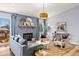 Cozy living room with a fireplace, comfortable seating, and stylish decor accents at 2484 E 101St Ct, Thornton, CO 80229