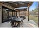 Covered patio with string lights, outdoor dining, and comfortable seating area at 6269 S Coventry E Ln, Littleton, CO 80123