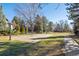 Community basketball court surrounded by mature trees and green space at 6269 S Coventry E Ln, Littleton, CO 80123