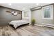 Modern basement bedroom has sleek plank flooring, natural light, and stylish decor at 6269 S Coventry E Ln, Littleton, CO 80123