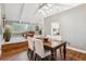 Elegant dining room with hardwood floors, modern lighting, and an open concept at 6269 S Coventry E Ln, Littleton, CO 80123