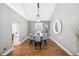 Formal dining room with modern lighting and a large window at 6269 S Coventry E Ln, Littleton, CO 80123