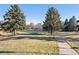 Community tennis court in a park-like setting with walking paths at 6269 S Coventry E Ln, Littleton, CO 80123