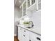 Elegant wet bar with quartz countertop and glass-front cabinets at 6269 S Coventry E Ln, Littleton, CO 80123