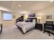 Bedroom featuring carpet, large window, desk, and open shelving to make the space your own at 6194 E Briarwood Cir, Centennial, CO 80112