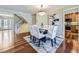 Bright dining area with hardwood floors, modern decor, and staircase view at 6194 E Briarwood Cir, Centennial, CO 80112