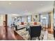 Open living room with hardwood floors, neutral color palette, and ample natural light at 6194 E Briarwood Cir, Centennial, CO 80112